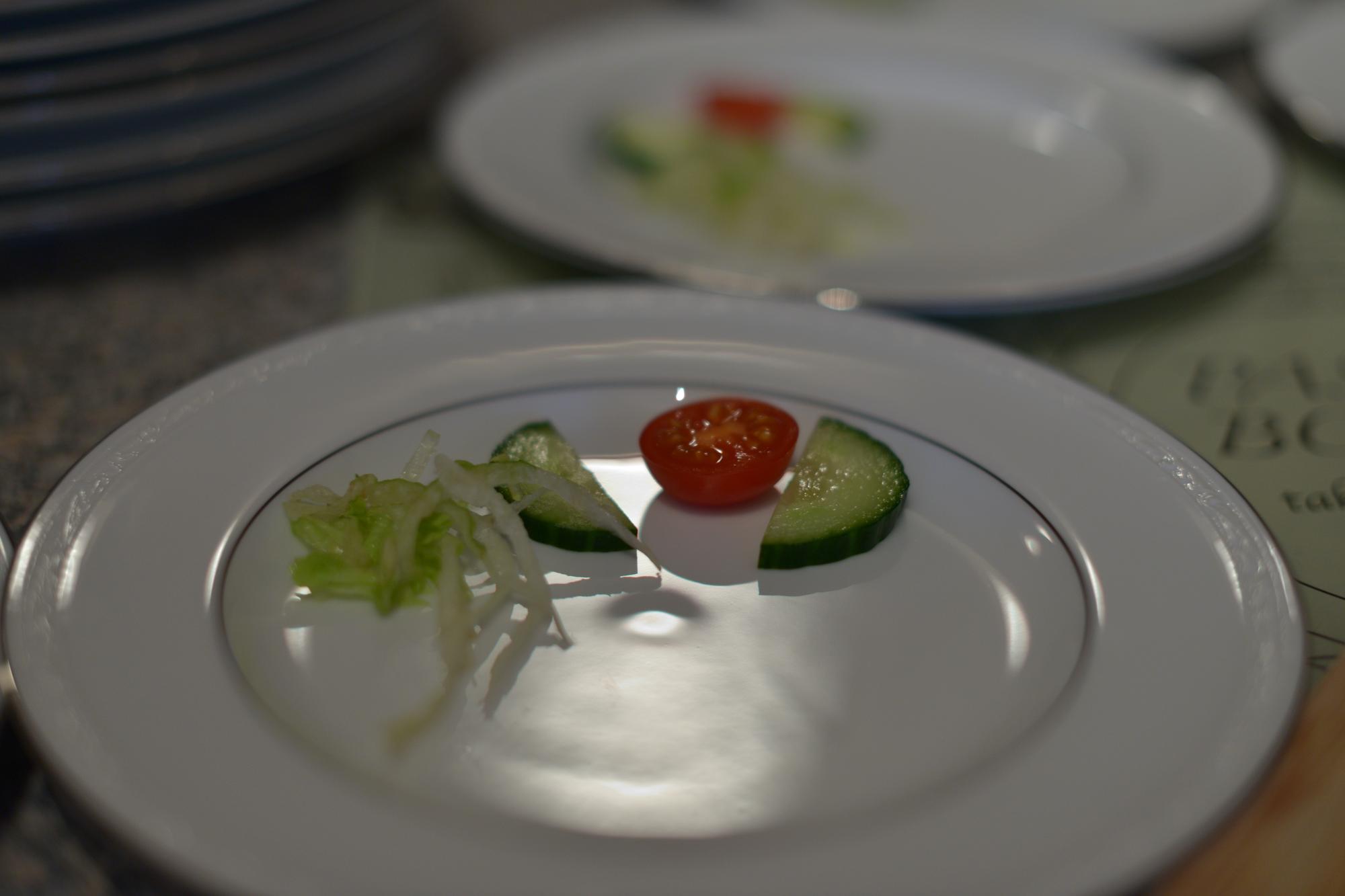 Close-up of plated dish and modern utensils