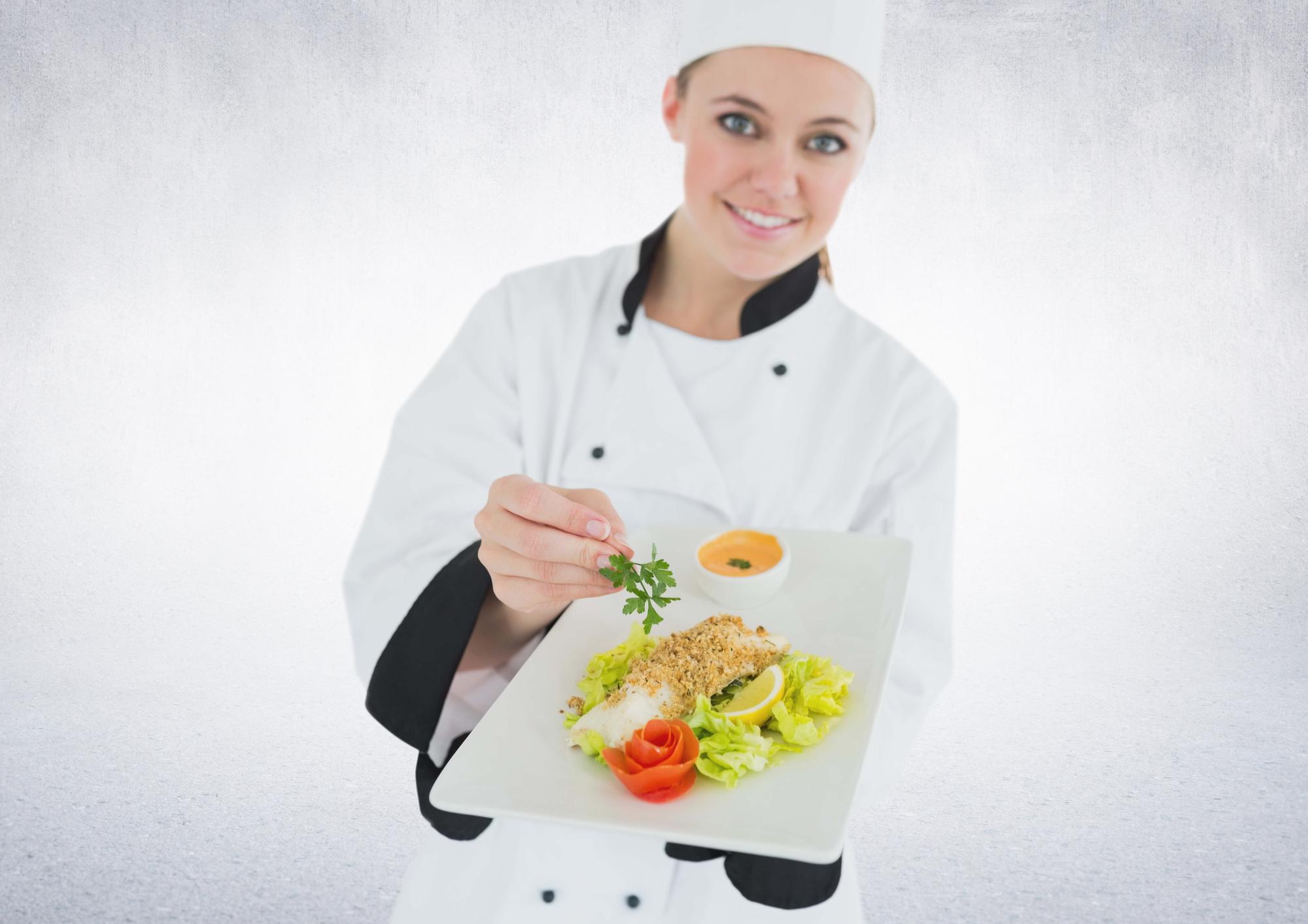 Student plating a modern entrée
